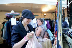 Photo of two people at a clothing swap.